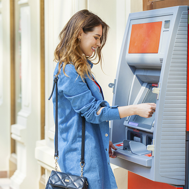 Woman at ATM machine
